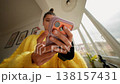 Teen With Pink Phone Case. Caucasian Teenager Using Mobile Phone With Pink Cover In Natural Light 138157431