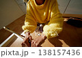 Young Lady Assembling Furniture Smoothly. Woman Tightening Screw On Wooden Chair In Sunlit Cozy Room 138157436