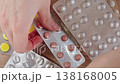 Close-up Woman Choosing Medication From Blister Packs And Pushing Out One Tablet. Healthcare Decision, Treatment Choice And Daily Routine Concept. 138168005