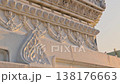 White temple wall ornate carvings detail golden hour light texture 138176663