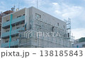 Erecting scaffolding 138185843