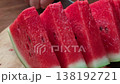 Fresh watermelon slices arranged on a board. 138192721