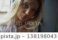 Face of Sexy Blonde Woman in Nightdress by Room Window in the Morning 138198043
