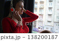 Face of Beautiful Blonde Woman With Headphones Listening Music by Room Window 138200187