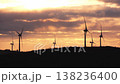 Wind turbines generating renewable energy at sunset 138236400