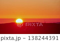 Stunning big sun sunset timelapse over dark mountain silhouette 138244391