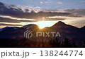 Vertical-ready winter mountain sunset timelapse with sunbeams and forest 138244774