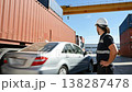 Worker with tablet at cargo storage place. He shows like sign with big finger. 138287478