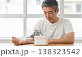 Middle-aged man having his blood pressure measured; lifestyle-related diseases and health check. Middle-aged man having his blood pressure measured; lifestyle-related diseases and health check. 138323542