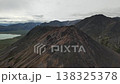 Pan over mountain summit and lakes at Penkigney Bay near Bering Strait 138325378