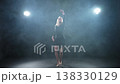 Contemporary woman dancer posing on black background with smoke. Adult female artist performer dancing with expression. Modern ballerina dancing in darkness. Passion dance in dark. Flexibility balance 138330129