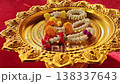 Decorative golden platter with fragrant flowers and ornate details 138337643