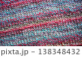 Close-up Texture of Handmade Knitted Clothing with Colorful Yarn Patterns 138348432