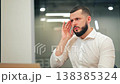 Overworked businessman rubbing eyes having headache at laptop in office 138385324