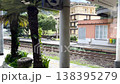 Ligurian regional train window view passing Camogli railway station. Cinematic travel footage showing traditional Italian architecture, green Mediterranean hills and empty platform on sunny day.  138395279