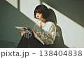 Japanese woman reading a magazine 138404838