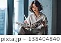 Japanese woman reading a magazine 138404840