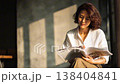 Japanese woman reading a magazine 138404841