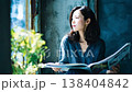 Japanese woman reading a magazine 138404842