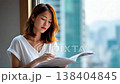 Japanese woman reading a magazine 138404845