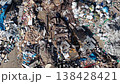 Drone overhead footage of dump site with mixed household, construction debris and plastic waste. 138428421
