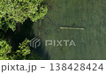 Aerial view drone view of submerged waste and pollution in coastal mangrove water 138428424