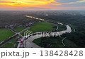 View from sky labuh Banting river bend at sunset with rice paddies, village docks and winding access roads. 138428428