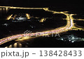 Aerial night footage of heavy traffic and car light trails on Andaman Island roadway. 138428433