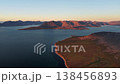 Pan right along coastline into Provideniya Bay, Chukotka in golden light 138456893