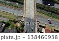 Top down aerial tracking shot of bridge crossing over highway 138460938