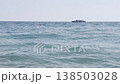 Boat travels on clear sea in daytime 138503028