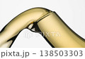 kettle spout and jet of tea 138503303