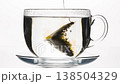 tea pyramid sinks into the cup 138504329
