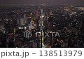 Aerial view of Bangkok at night with illuminated skyscrapers and bustling city life, showcasing Thailand capital's modern skyline 138513979