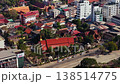 Aerial shot flying over urban development and construction of a new stadium in downtown Vientiane, Laos on a sunny day 138514775