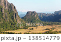 Scenic Laos landscape with karst mountains and Vang Vieng rice fields from aerial viewpoint, travel and nature background 138514779