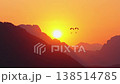 Cinematic sunrise over Vang Vieng: Hot air balloons silhouetted against a golden sun and misty karst mountains in Laos 138514785