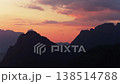 Cinematic golden sunrise with hot air balloon and intense lens flare over Vang Vieng Karst Mountains, Laos during a tourist experience 138514788