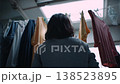 A woman hanging up the laundry 138523895