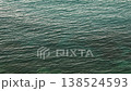 Aerial Top-Down View of Gentle Turquoise Sea Waves and Ripples 138524593