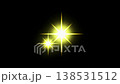 Video footage of a yellow star-shaped lens flare shining against a black background. 138531512