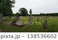 A Cemetery With A Statue Of A Man On Top Of A Cross 138536602