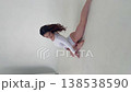 Graceful dancer posing in a white leotard 138538590