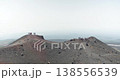 Two groups of tourists standing on a volcanic hill near Etna Volcano, Sicily, 4k 138556539