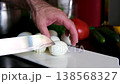 A male hand picks up boiled chicken eggs from the table as the camera glides through them. Dolly slider, close-up. 138568327