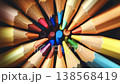 Wooden colored pencils arranged in a circle spinning together, creating a vibrant and mesmerizing kaleidoscopic effect against a dark, sparkling background, perfect for creative concepts 138568419