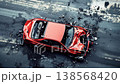Devastating aftermath of a traffic collision shown from an aerial view, with a smashed red sedan on the asphalt road surrounded by shattered parts, broken glass, and vehicle debris 138568420