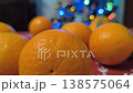 Tangerines on the Christmas table. Festive atmosphere. 138575064