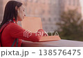 Hopeful university student contemplating her future at sunset 138576475