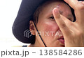 A woman treats a wound on her forehead while camping amateur portrait 138584286